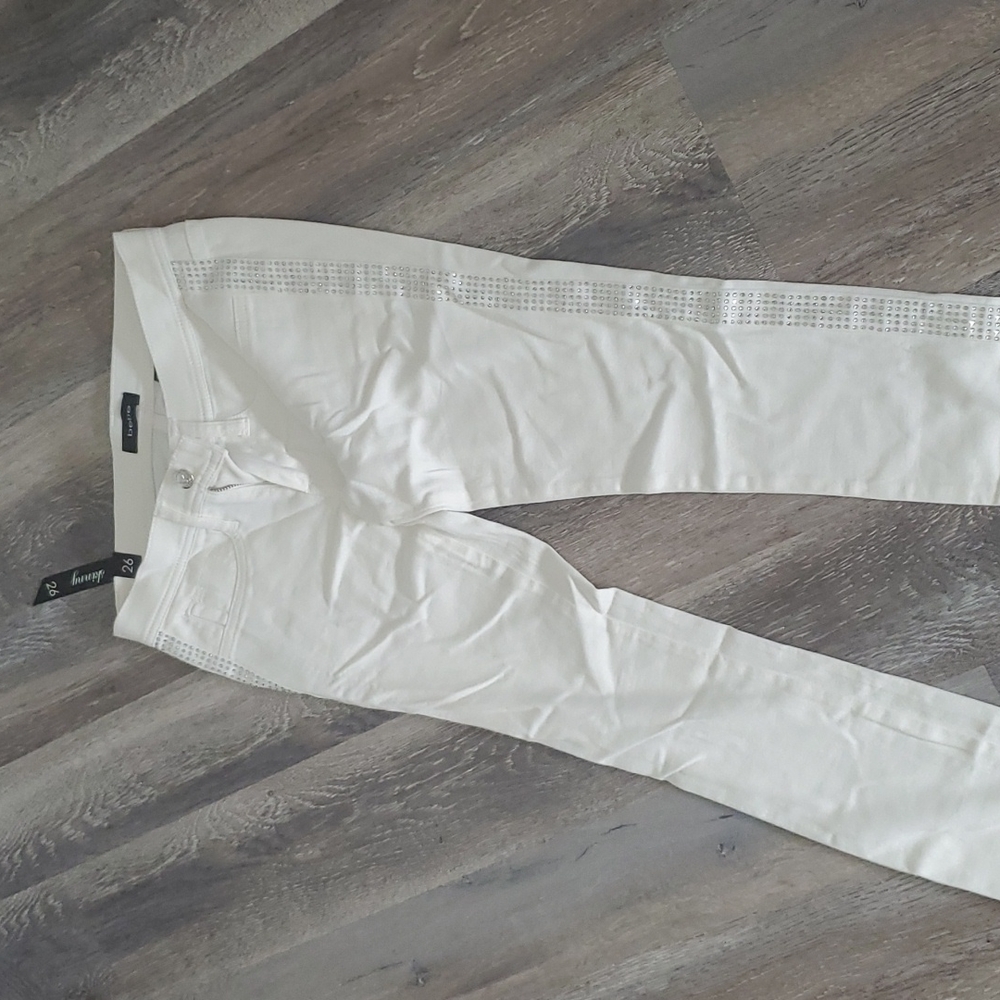 Bebe white pants with bling on the sides